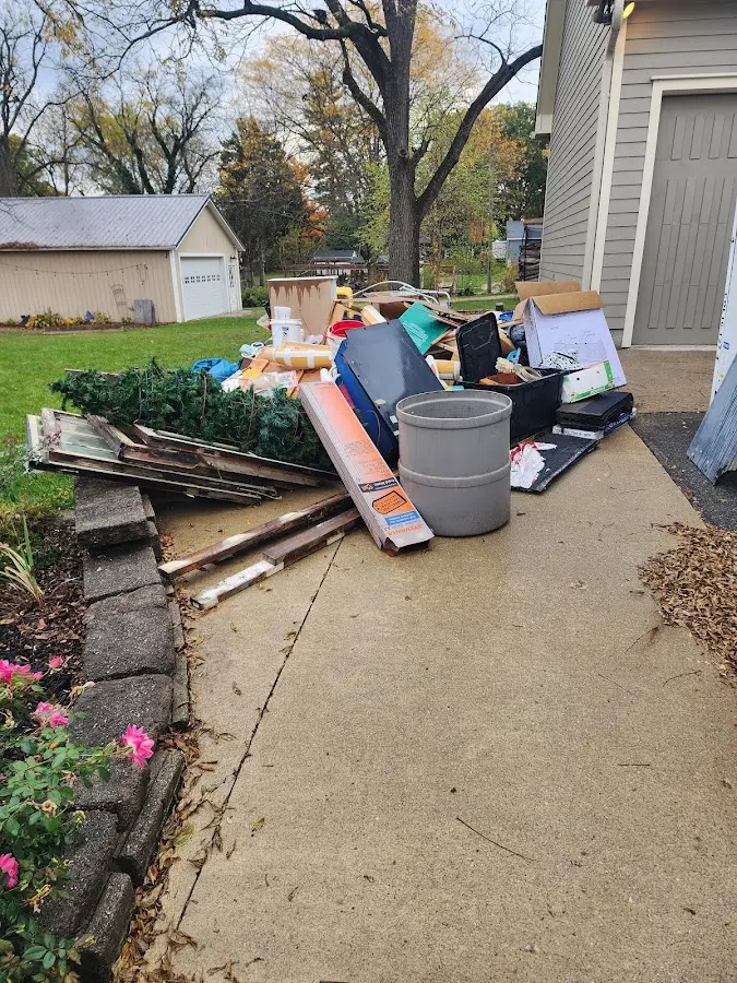 Dumpster being loaded with debris for 3 Yard Dumpster Rental in Escalon